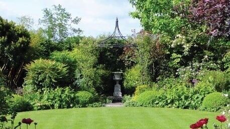 british garden with lawn and borders