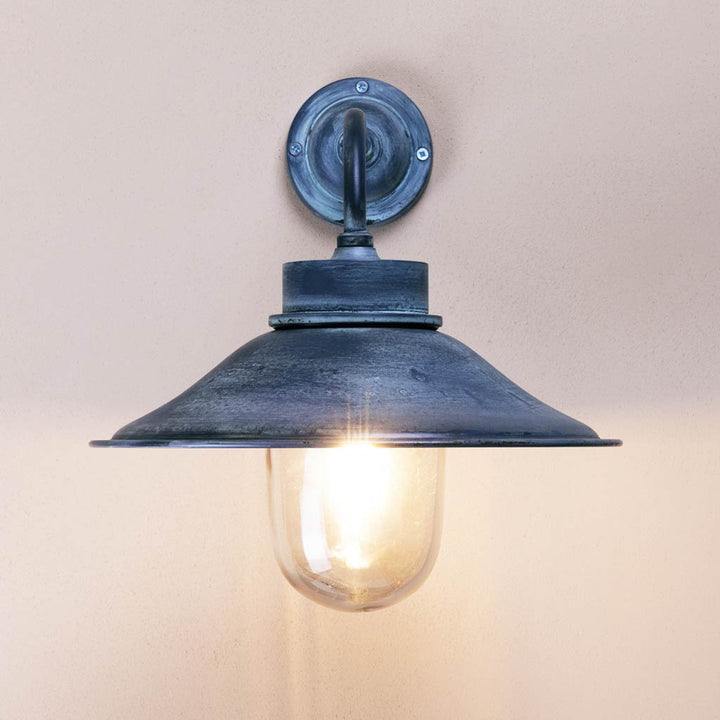 Vintage-style wall light fixture on a plain background