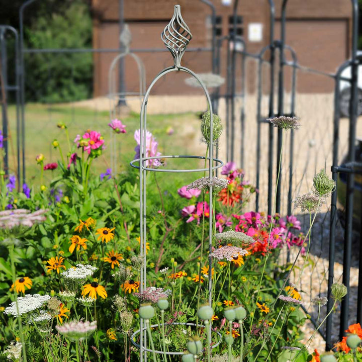 grey-elegance-obelisk-with-colourful-flowers-surrounding