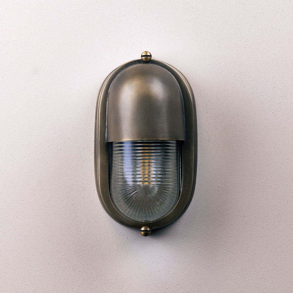 Bronze outdoor wall light fixture on a white background