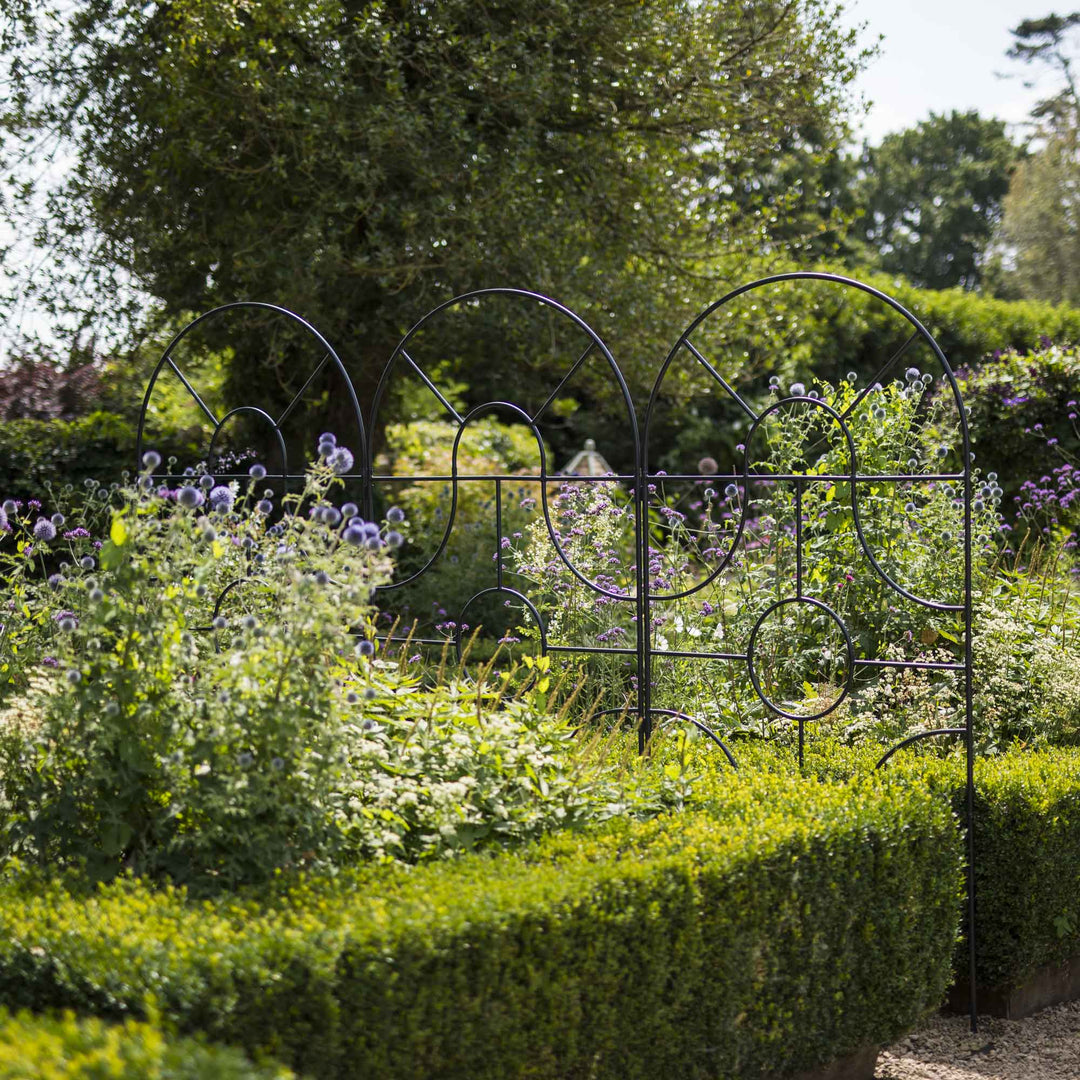 Angled shot of Agriframes georgian round top screens on the edge of a path