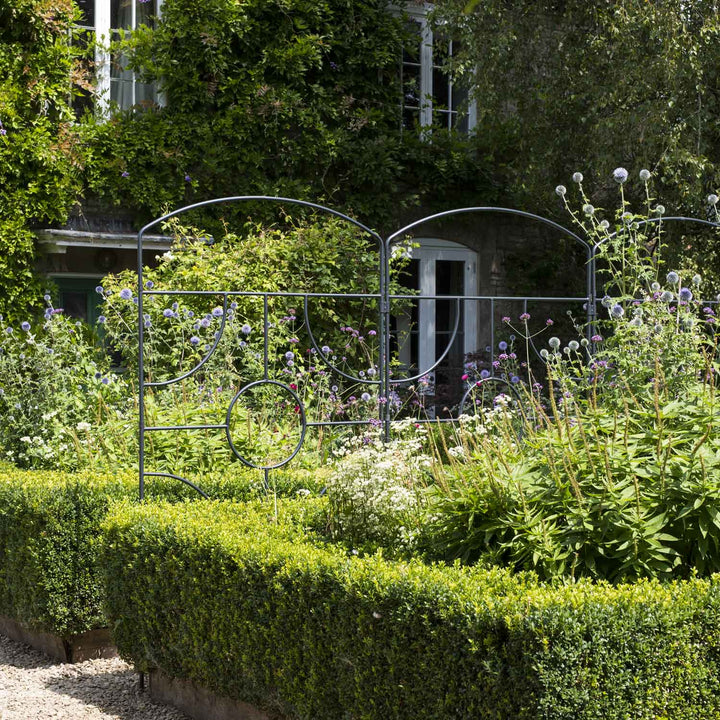 Agriframes georgian monet screens with a cottage in background
