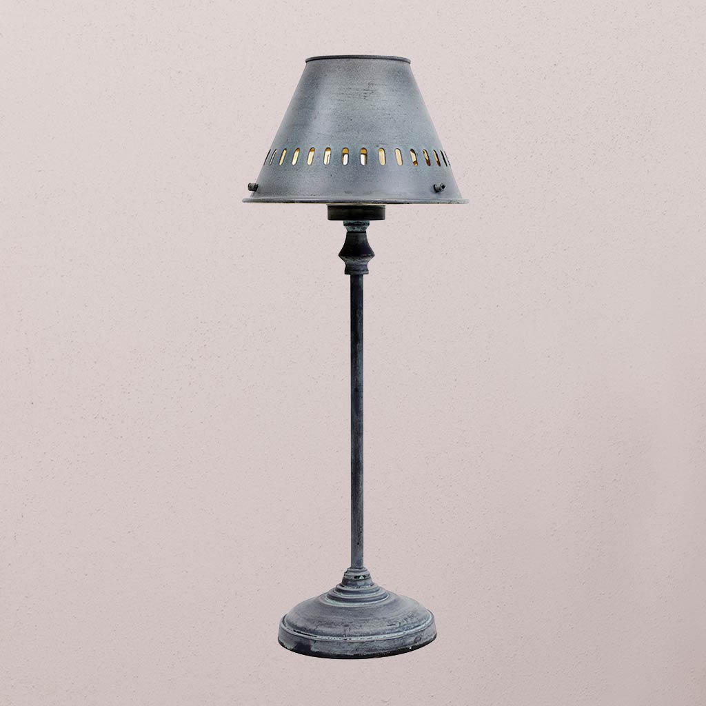 Vintage-style table lamp with a dark gray shade on a light beige background