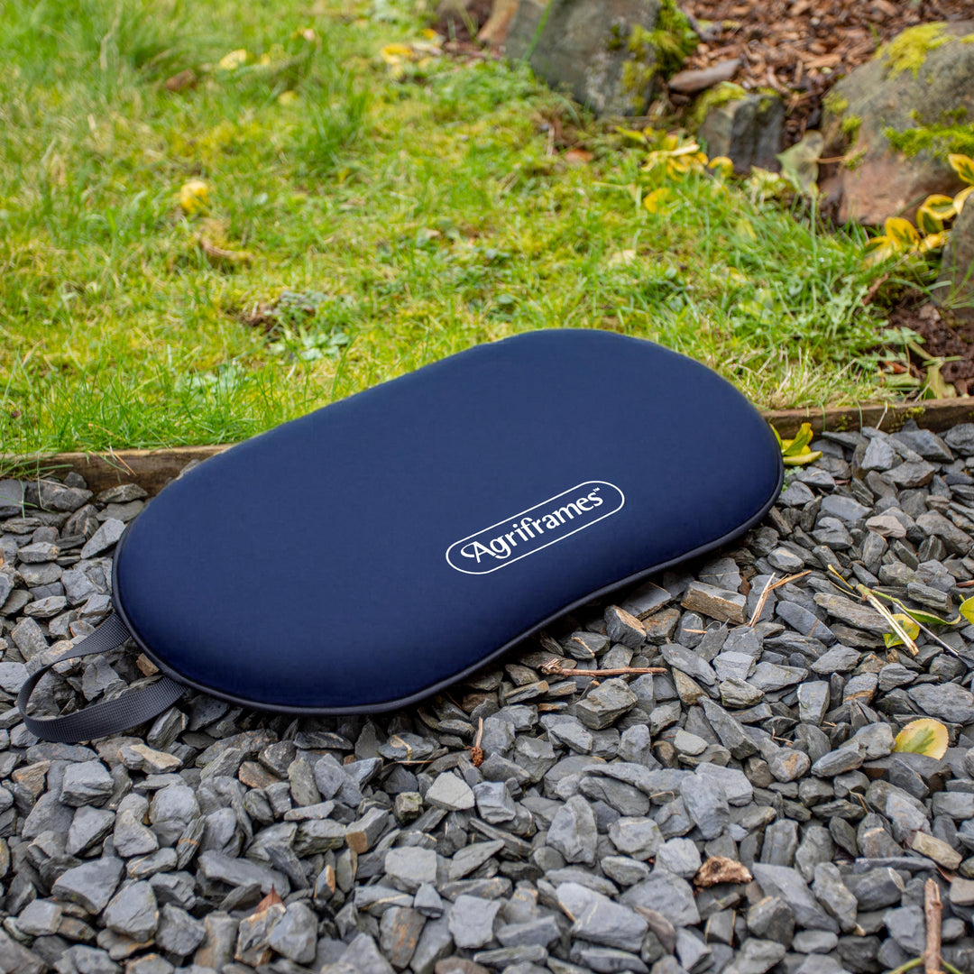 Blue Agriframes product on a gravel surface with grass in the background