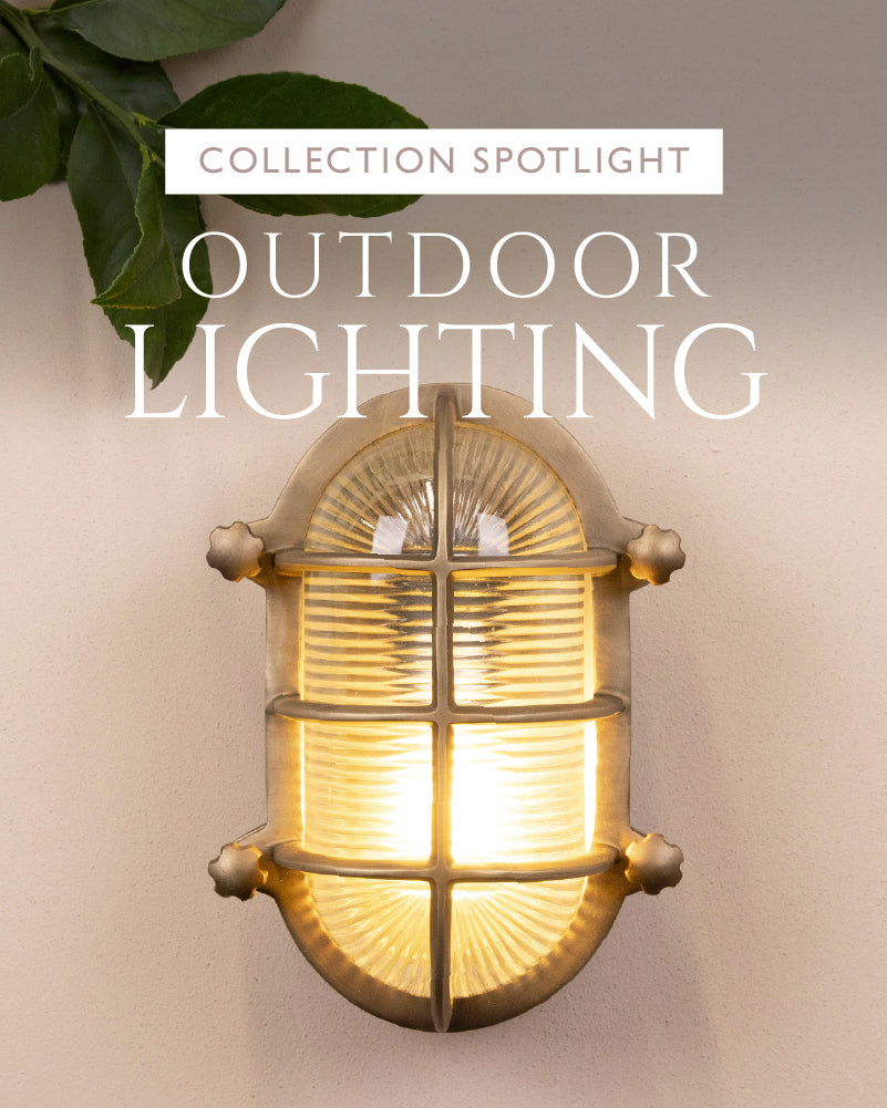 Outdoor wall light fixture with warm glow on a neutral background, featuring 'Collection Spotlight: Outdoor Lighting' text.