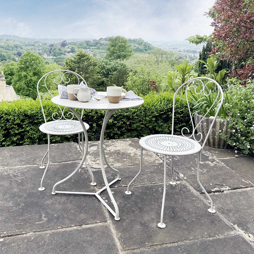 cream metal garden table and chairs