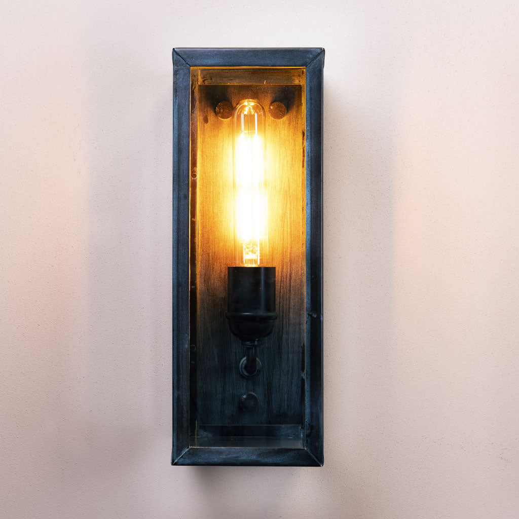 Wall-mounted light fixture with a wooden frame on a white background