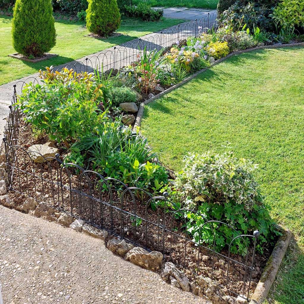Birds eye view of Agriframes Border Edging Hoops installed in a lawn border.