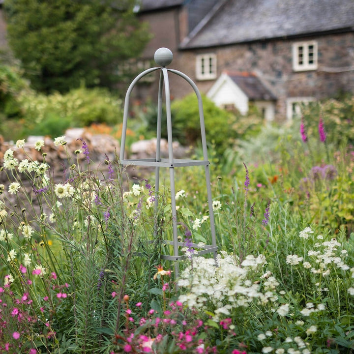 Agriframes Classic Square Obelisk in Sage Green in a flowerbed