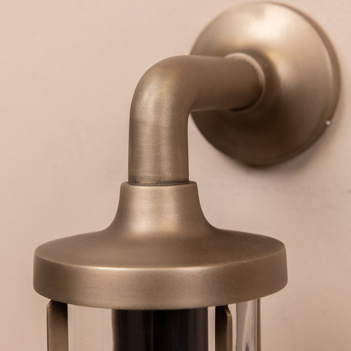 Closeup image of the Agriframes Exmouth Outdoor Wall Lamp in a Brass finish.