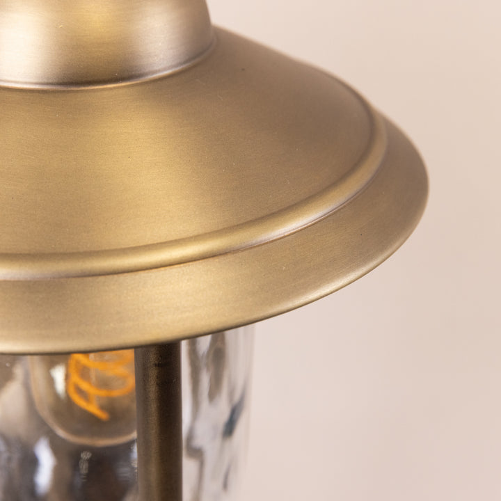 Closeup image of the shade of the Agriframes Kensington Wall Lamp in a brass finish. 