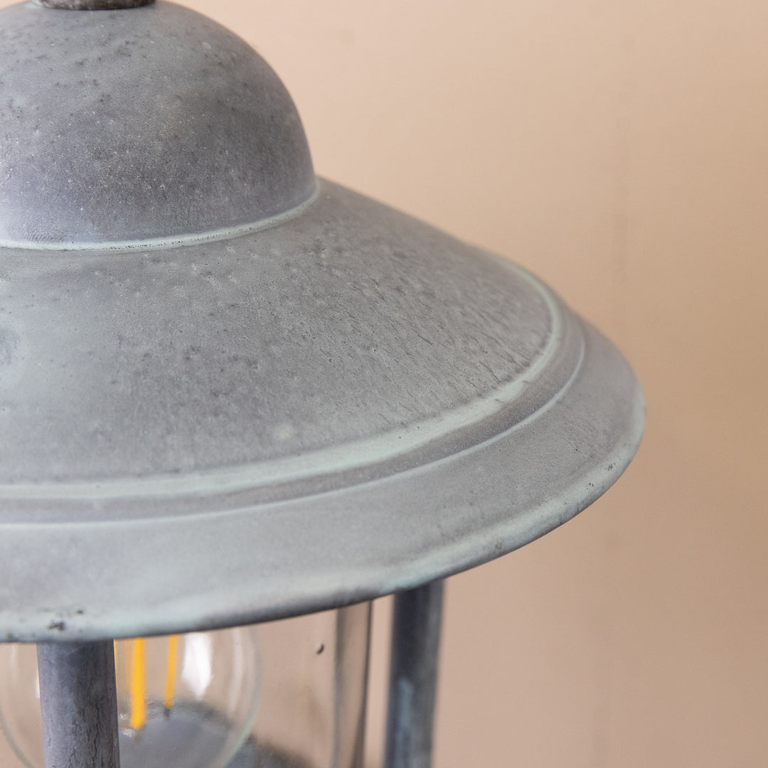 Closeup image of the Agriframes Kensington Wall Lamp in an Old Iron finish.