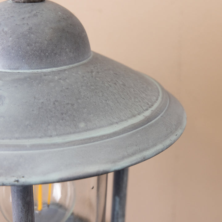 Closeup image of the Agriframes Kensington Wall Lamp in an Old Iron finish.