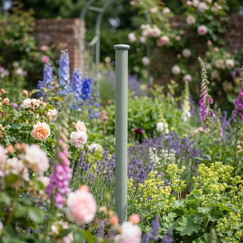 Agriframes Elegance Screen Mounting Pole installed in a flowerbed