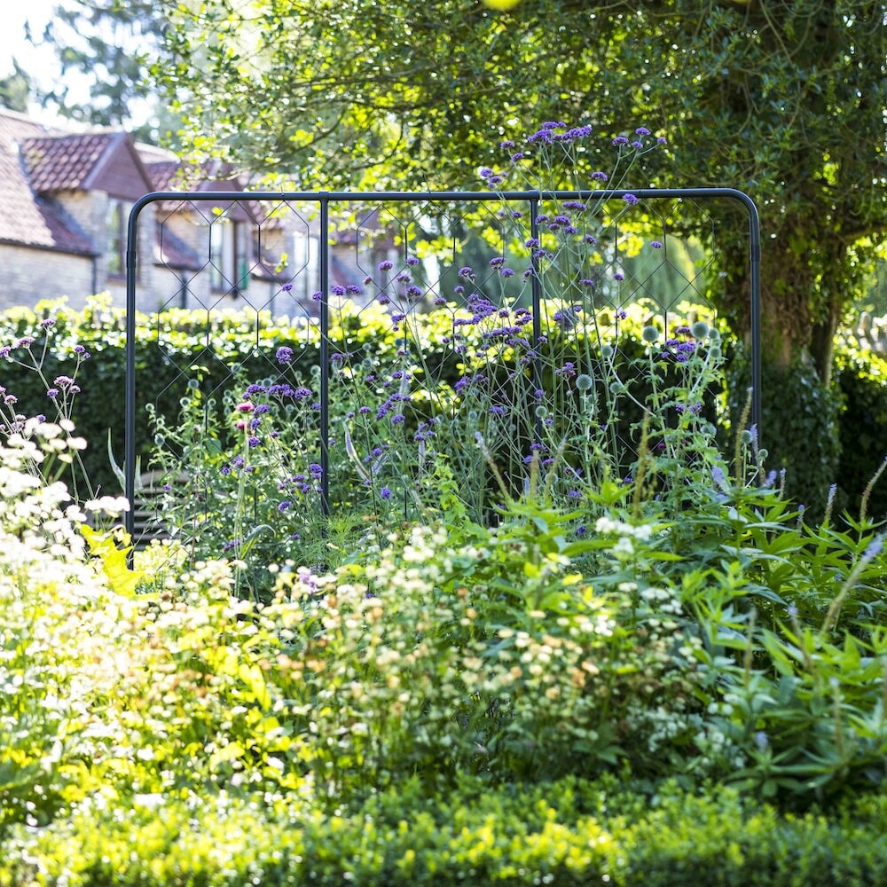 Agriframes standard flat fencing screen in a flowerbed