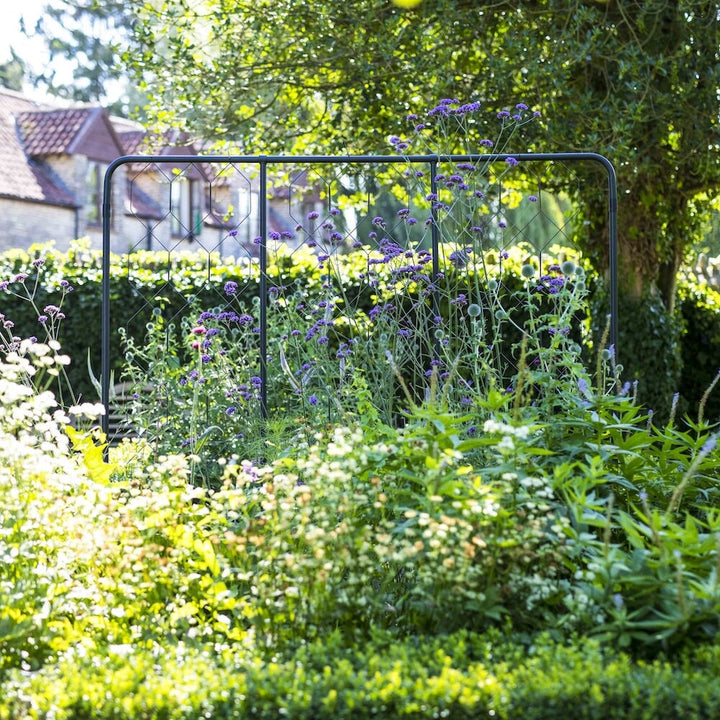 Agriframes standard flat fencing screen in a flowerbed