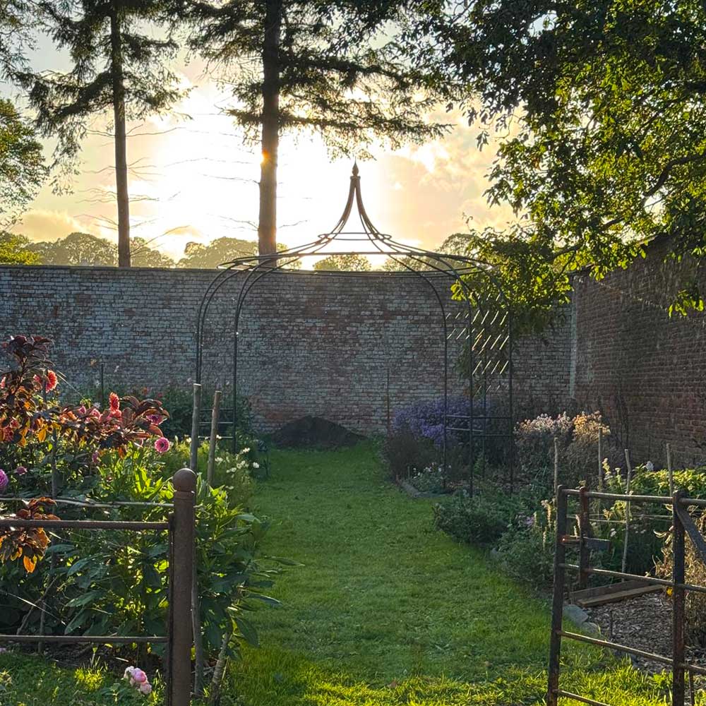 gothic-gazebo-in-jenny-williams-garden-with-sunset-in-the-background