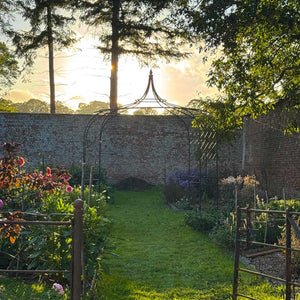 gothic-gazebo-in-jenny-williams-garden-with-sunset-in-the-background