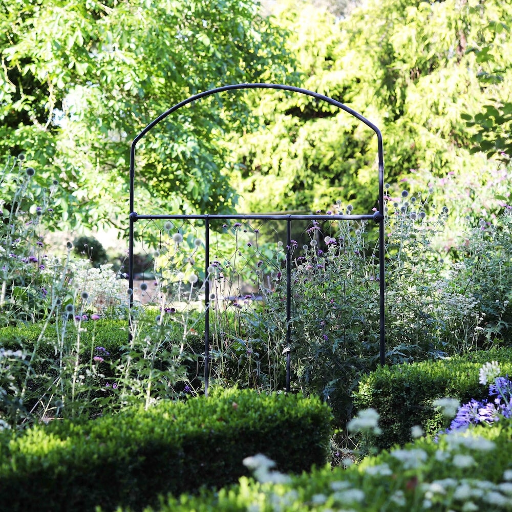 Agriframes monet fencing screen amongst a floral garden scene