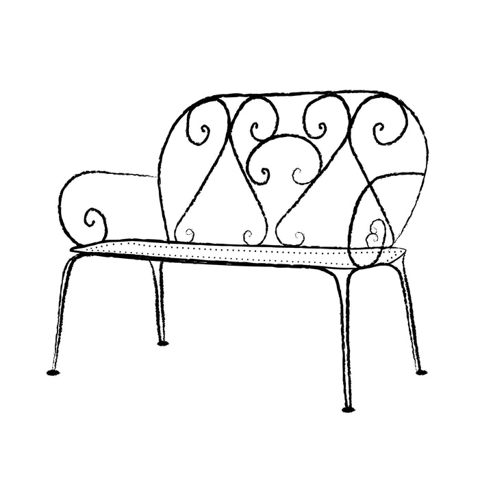 Decorative metal bench with intricate designs on a white background