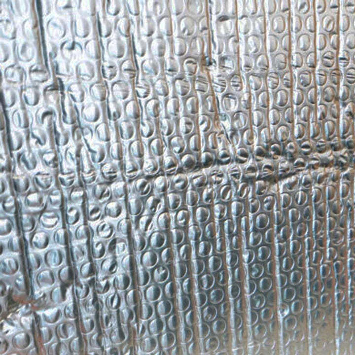 Textured metallic surface with embossed pattern