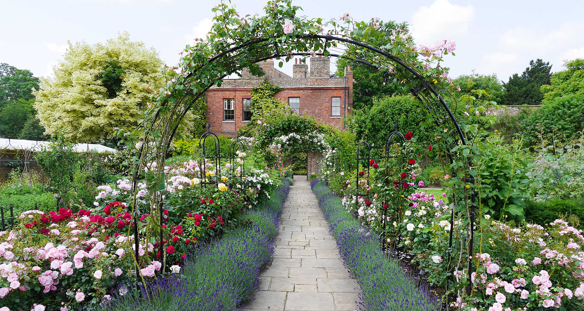 Round Arch with flowers and Obelisks growing amongst 