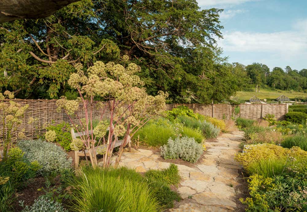 the_newt_garden_with_bench_in_flowers