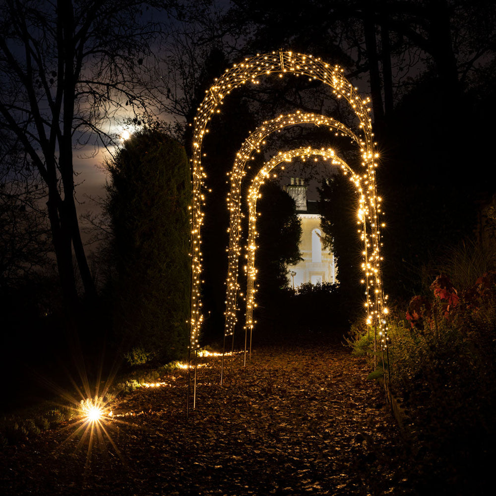 fairy lights on metal garden arch