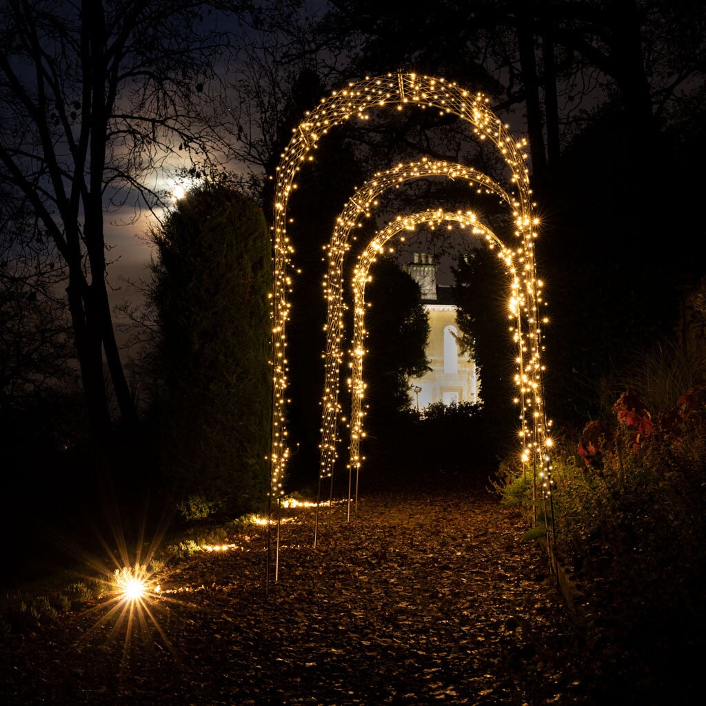 fairy lights on metal garden arch