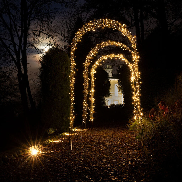 fairy lights on metal garden arch