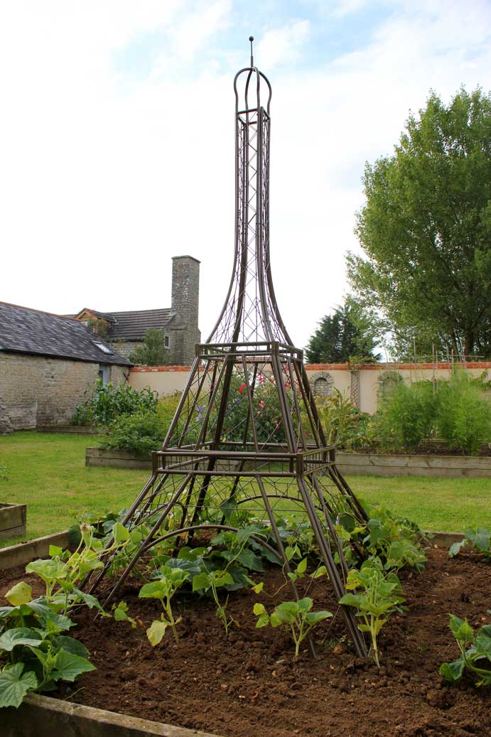 Eiffel tower plant frame in a garden 