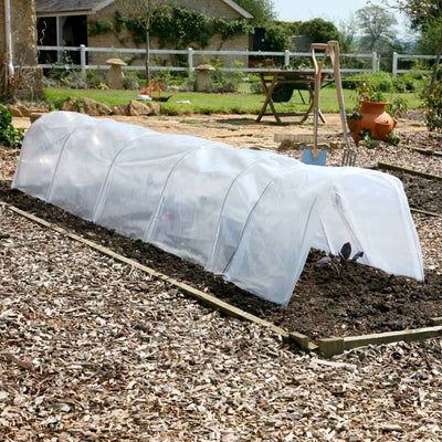 easy poly tunnel in use in a garden open end showing fruit