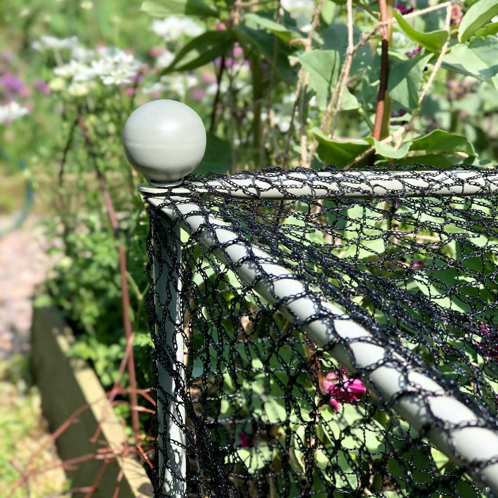 Closeup image of a round finial on the Agriframes Elegance Vegetable Cage