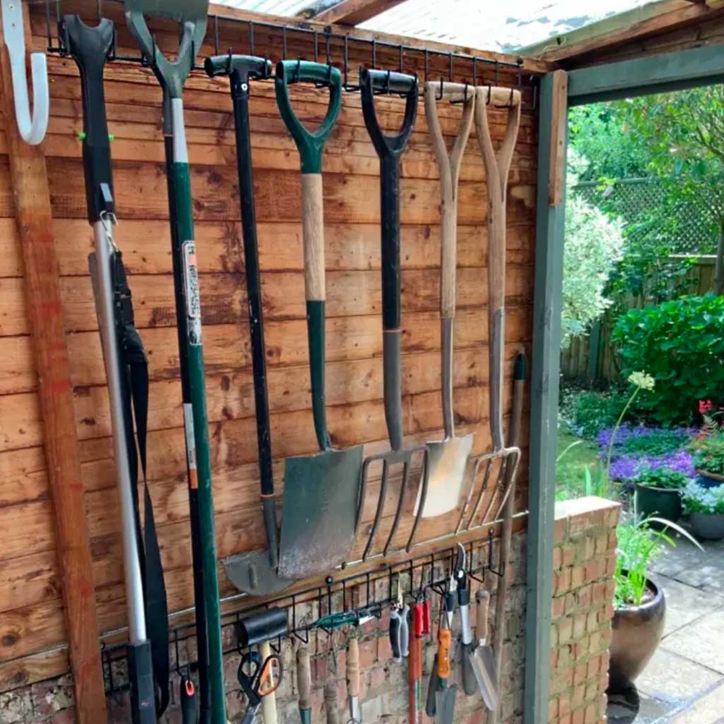 tool rack with garden tools on