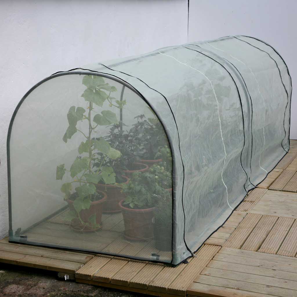 Agriframes Micromesh Grower Frame housing several different varieties of plant on a wooden deck. 