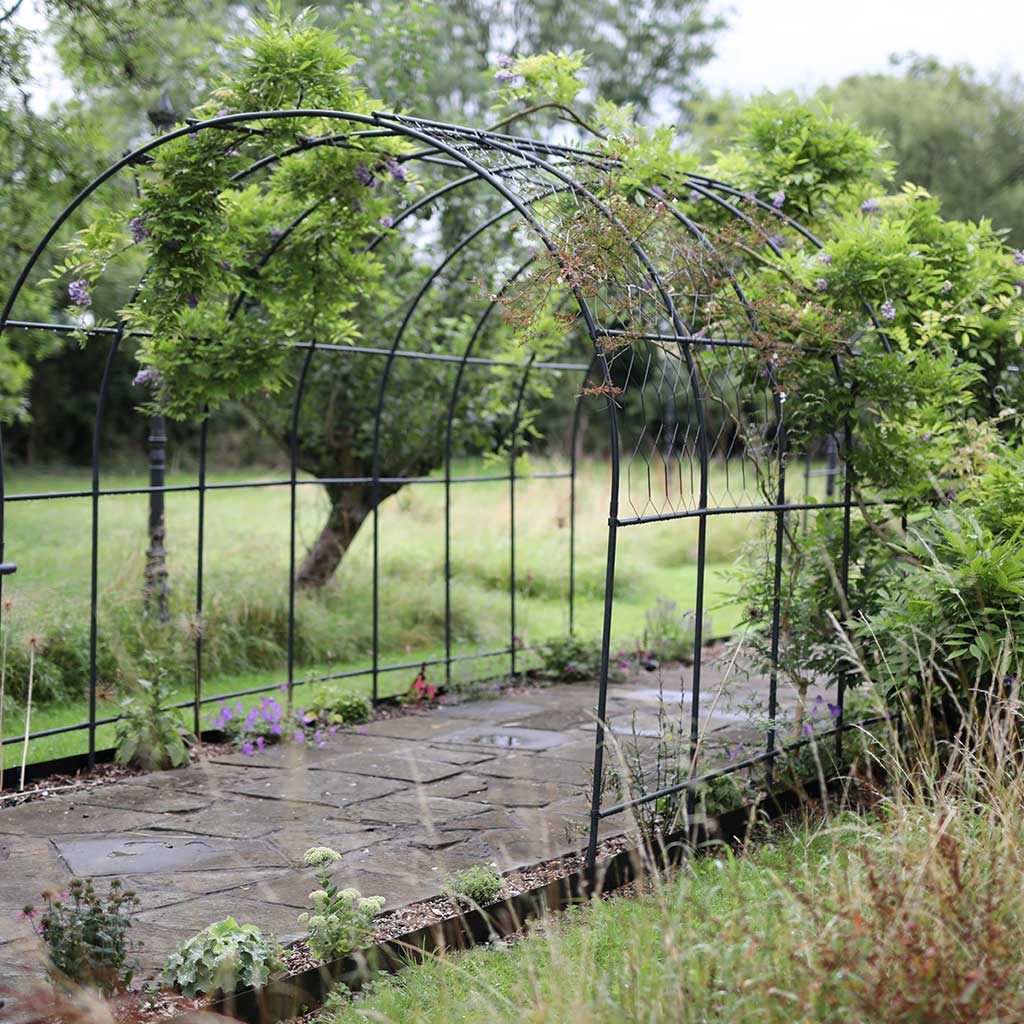 round tubular matt black pergola with lattice 